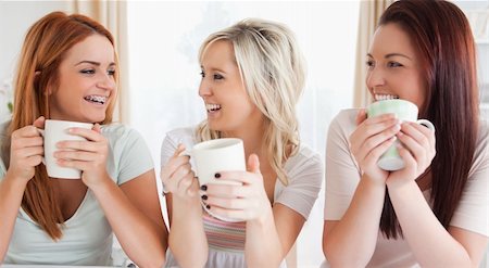Young Women sitting at a table with cups in a kitchen Stock Photo - Budget Royalty-Free & Subscription, Code: 400-04919144