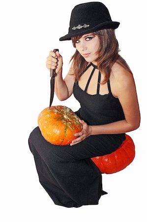 simsearch:400-09132992,k - Witch holds in the hands knife and pumpkin Stock Photo - Budget Royalty-Free & Subscription, Code: 400-04919418