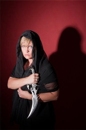 simsearch:400-05347613,k - Caucasian witch wearing in hood with athame dagger Stock Photo - Budget Royalty-Free & Subscription, Code: 400-04910594
