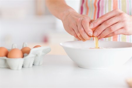 Woman with eggs in a kitchen Stock Photo - Budget Royalty-Free & Subscription, Code: 400-04910893