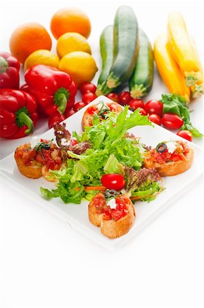 simsearch:400-08291219,k - original Italian fresh bruschetta,typical finger food, with fresh salad and vegetables on background,MORE DELICIOUS FOOD ON PORTFOLIO Stock Photo - Budget Royalty-Free & Subscription, Code: 400-04911121