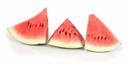 simsearch:400-05886533,k - Fresh segment of a watermelon on a white background Photographie de stock - Aubaine LD & Abonnement, Code: 400-04911439