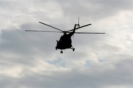 photovova (artist) - Helicopter flight in blue cloudy sky, Flying helicopter Foto de stock - Super Valor sin royalties y Suscripción, Código: 400-04911522