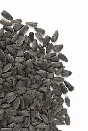 detail of sunflower - Black sunflower seeds isolated on a white background Stock Photo - Budget Royalty-Free & Subscription, Code: 400-04911579