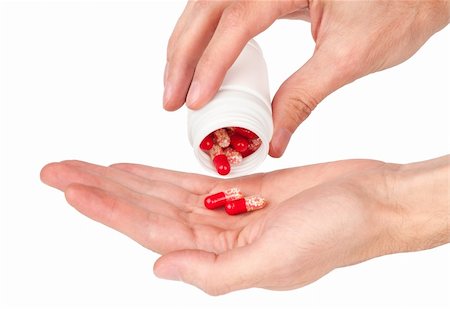 pills in a human hand isolated on white Photographie de stock - Aubaine LD & Abonnement, Code: 400-04911668