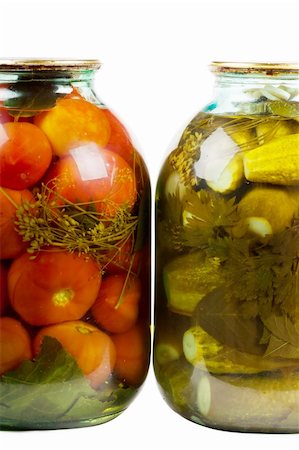 pickling gherkin - Two jars of pickles and tomatoes isolated over white background Stock Photo - Budget Royalty-Free & Subscription, Code: 400-04912107