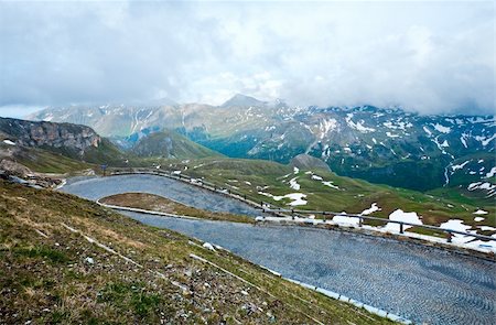 Tranquil summer Alps mountain and serpentines of Grossglockner High Alpine Road. Stockbilder - Microstock & Abonnement, Bildnummer: 400-04912471