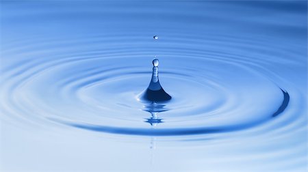 simsearch:400-04988892,k - Clean blue drop of water splashing in clear water. Abstract blue background Stock Photo - Budget Royalty-Free & Subscription, Code: 400-04912554