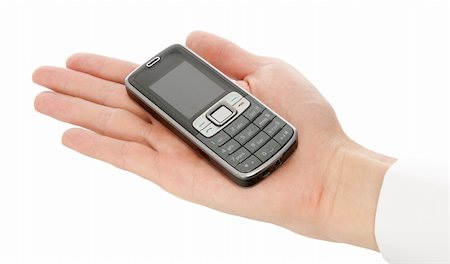 Cell phone in a hand isolated on white Stock Photo - Budget Royalty-Free & Subscription, Code: 400-04912555