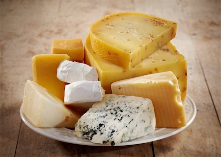 foodphoto (artist) - various types of cheese on a white plate Fotografie stock - Microstock e Abbonamento, Codice: 400-04912678