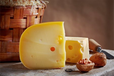 foodphoto (artist) - still life with cheese and walnuts on old wooden table Fotografie stock - Microstock e Abbonamento, Codice: 400-04912778