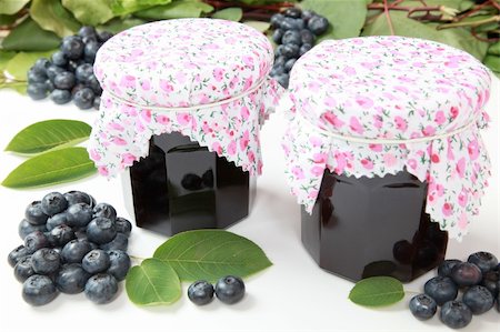 Two glasses of homemade blueberry jam with fresh fruits and leaves Stock Photo - Budget Royalty-Free & Subscription, Code: 400-04912950