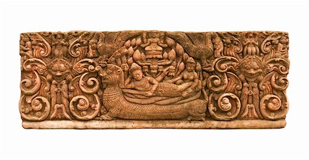 Carved sandstone  king bed on the back of Dragon the old wall.The old castle in Thailand Stock Photo - Budget Royalty-Free & Subscription, Code: 400-04913134