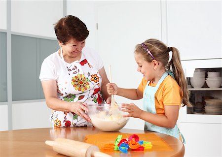 simsearch:400-07792994,k - Grandmother and granddaughter baking and having fun together Photographie de stock - Aubaine LD & Abonnement, Code: 400-04913161