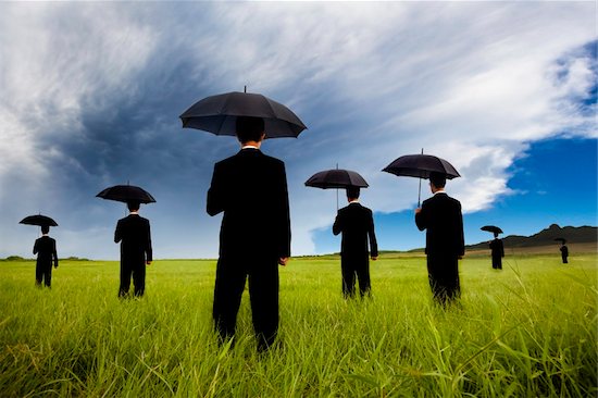 businessman in black suit  holding umbrella and watching the storm coming Stock Photo - Royalty-Free, Artist: tomwang, Image code: 400-04913949
