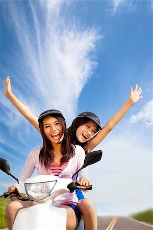 Happy young woman having summer trip on a scooter Photographie de stock - Aubaine LD & Abonnement, Code: 400-04913958