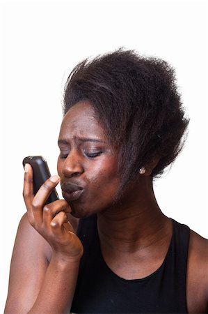 simsearch:400-05321860,k - Beautiful Black Woman kissing mobile Phone Foto de stock - Super Valor sin royalties y Suscripción, Código: 400-04924271