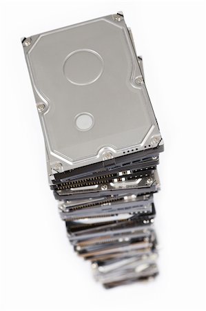 stack of hard drives on white background. Top view with selective focus. Photographie de stock - Aubaine LD & Abonnement, Code: 400-04924469