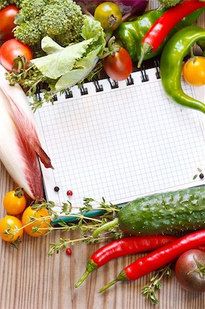 recipes paper - Open notebook and fresh garden vegetables and herbs. Foto de stock - Super Valor sin royalties y Suscripción, Código: 400-04925008