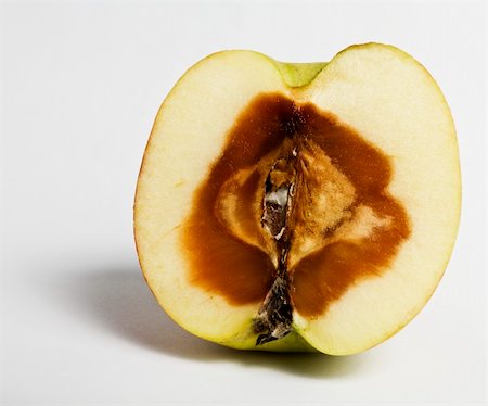 decaying fruit photography - stinky apple devided. rotten from the inside Stock Photo - Budget Royalty-Free & Subscription, Code: 400-04925427
