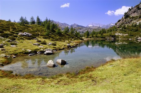 simsearch:400-07210714,k - Summer Alpine lake view, Agro Lake, Italy Fotografie stock - Microstock e Abbonamento, Codice: 400-04925483