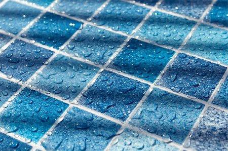 Blue Tiles in Swimming Pool With Water Drops in Sunlight Stock Photo - Budget Royalty-Free & Subscription, Code: 400-04925543