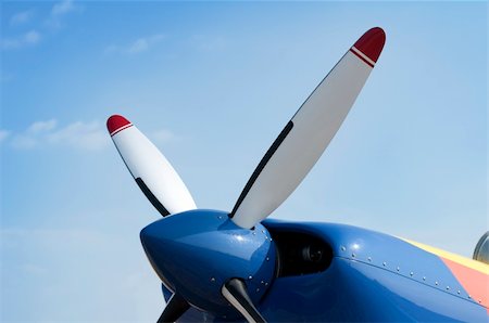 White plane propeller on blue sky background Stock Photo - Budget Royalty-Free & Subscription, Code: 400-04925633