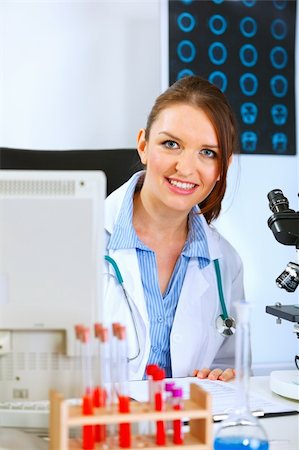 simsearch:400-07519214,k - Smiling doctor woman looking out from monitor Stock Photo - Budget Royalty-Free & Subscription, Code: 400-04925796