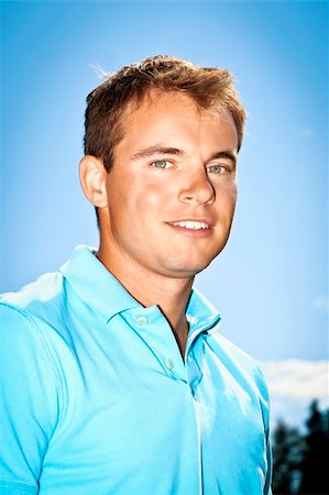 A handsome young man in front of the blue sky Stock Photo - Budget Royalty-Free & Subscription, Code: 400-04920104