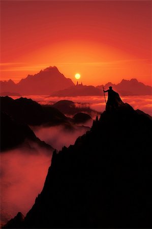 A fantasy image with a man watching to the far city and the sunset in red Stock Photo - Budget Royalty-Free & Subscription, Code: 400-04920109