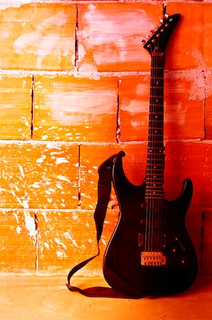 Electric guitar on old wall - copyspace Photographie de stock - Aubaine LD & Abonnement, Code: 400-04920167