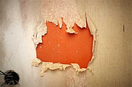 close up of a orange hole in a wallpaper Stock Photo - Budget Royalty-Free & Subscription, Code: 400-04920618