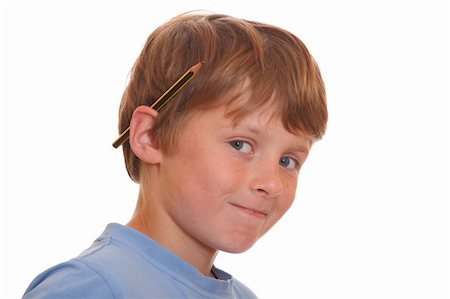 simsearch:400-04123378,k - Portrait of a young boy with a pencil behind his ear Photographie de stock - Aubaine LD & Abonnement, Code: 400-04920938