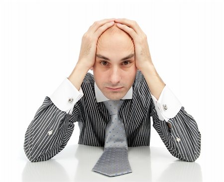 simsearch:400-06875322,k - Young depressed businessman looking at the camera Fotografie stock - Microstock e Abbonamento, Codice: 400-04921019