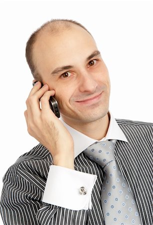 Portrait de gros plan d'un heureux guy jeune parlant sur téléphone cellulaire sur fond blanc Photographie de stock - Aubaine LD & Abonnement, Code: 400-04921022