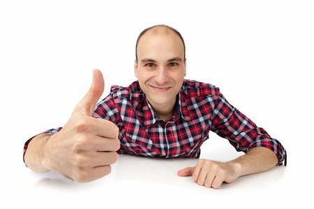 simsearch:400-04775272,k - Happy casual young man showing thumb up and smiling isolated on white background Photographie de stock - Aubaine LD & Abonnement, Code: 400-04921090
