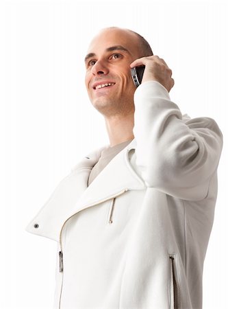happy young guy speaking on cellphone isolated on white background Foto de stock - Super Valor sin royalties y Suscripción, Código: 400-04921113