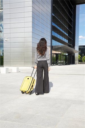 skyscraper company suit - business woman next to skyscrapers in Madrid city Spain Foto de stock - Super Valor sin royalties y Suscripción, Código: 400-04921605