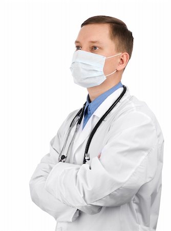 young doctor wearing a mask isolated over white Stock Photo - Budget Royalty-Free & Subscription, Code: 400-04921622