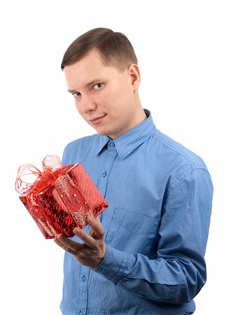 a young man offering a gift to you Stock Photo - Budget Royalty-Free & Subscription, Code: 400-04921653