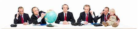 A single person's call center of a self employed businessman answering various questions by telephone. A conceptual image of being flexible, multitasking and service oriented Stockbilder - Microstock & Abonnement, Bildnummer: 400-04922083