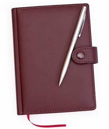 brown red leather notebook with pen over white background Photographie de stock - Aubaine LD & Abonnement, Code: 400-04922138