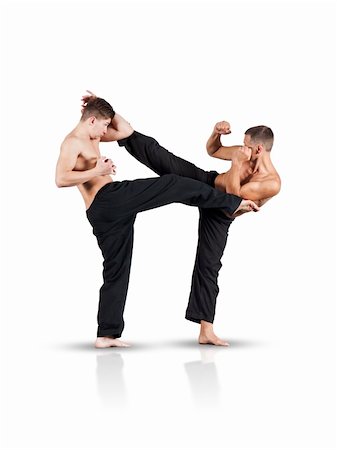 foot kick - An image of two fighting men isolated on white background Stock Photo - Budget Royalty-Free & Subscription, Code: 400-04922482