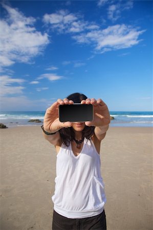 simsearch:400-05918503,k - smart phone in woman hand on a beach in Asturias Spain Photographie de stock - Aubaine LD & Abonnement, Code: 400-04922942