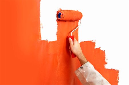 Hand with paint roller covered in bright orange, painting over a white wall Photographie de stock - Aubaine LD & Abonnement, Code: 400-04923206