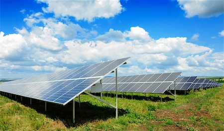 simsearch:400-07115437,k - Solar panel produces green, enviromentaly friendly energy from the sun. Photographie de stock - Aubaine LD & Abonnement, Code: 400-04923238