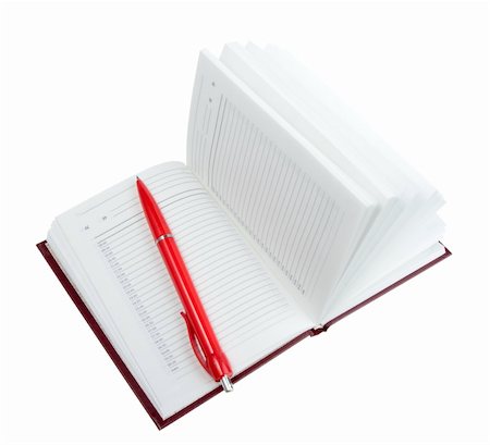 Empty open diary and red ball point pen. Close-up. Isolated on white background. Studio photography. Stock Photo - Budget Royalty-Free & Subscription, Code: 400-04923551