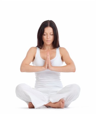 woman sitting on the floor exercising yoga - isolated on white Stock Photo - Budget Royalty-Free & Subscription, Code: 400-04923632