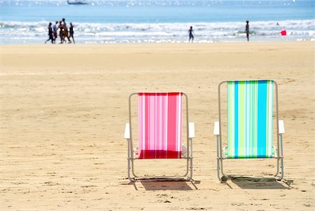 Two empty colorful beach chairs on a sandy beach Stock Photo - Budget Royalty-Free & Subscription, Code: 400-04935088
