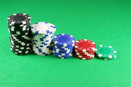 5 stacks of Poker chips on an isolated background Stock Photo - Budget Royalty-Free & Subscription, Code: 400-04935136